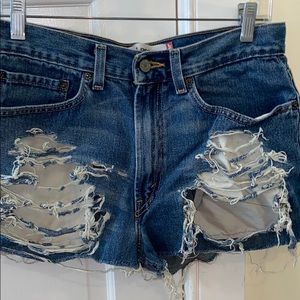 Distressed Levi 569 denim shorts